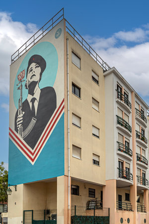 LISBON,PORTUGAL-APRIL 6,2024:Building decorated with the symbol of the Carnation Revolution of 1974 which got its name because were placed carnations in the muzzles of guns and on the soldiers uniformのeditorial素材