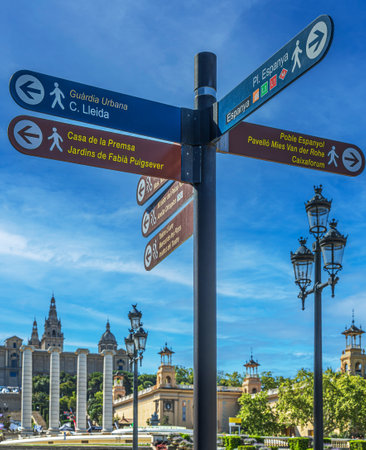 BARCELONA, SPAIN - APRIL 14, 2024: Street signs marking the direction to the few famous sites to visit in Barcelona.のeditorial素材