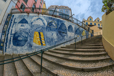 LISBON, PORTUGAL - 6 APRIL 2024: Beautiful wall on R. da Mae de Agua street, decorated with a modern artwork in the local technique of decorated ceramics called Azulejos, by artist Luis Camacho.のeditorial素材