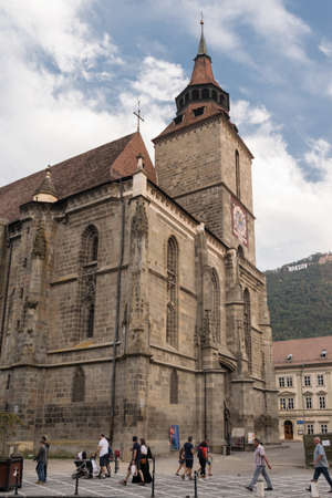 Brasov,Transylvania,Romania - September 22 2016 : Tourist walk along side the famous gothic style monument known as "Black Church" circa 2016のeditorial素材