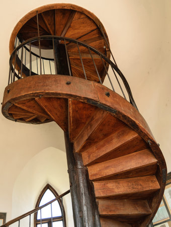 old vintage wood spiral staircase - bottom viewの写真素材