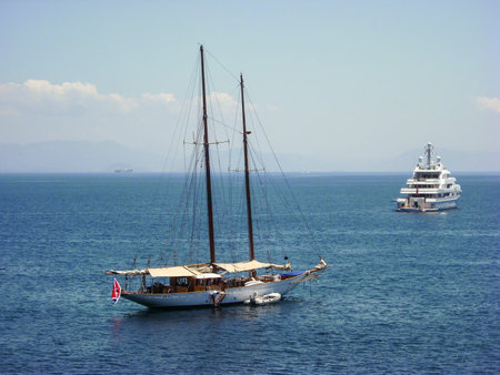 passenger and tourist ships in the ionian sea sailing away.
