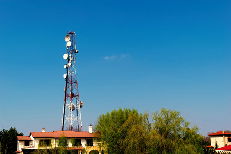 wireless gsm antenna tower installed in residential area with copy space