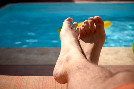 Someone's feet in the sunの写真素材