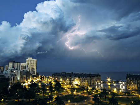 A ray illuminating the city at night.の写真素材