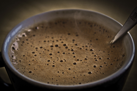 A cup of hot coffee on a cold winter afternoon.の写真素材