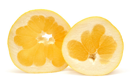 Ripe fruit pomelo half and pomelo isolated on white backgroundの写真素材