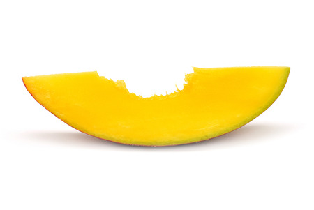 A piece of mango bite isolated on white backgroundの写真素材