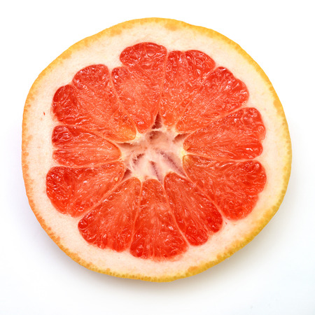 Half grapefruit citrus fruit isolated on white backgroundの写真素材