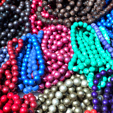 Beads colorful beautiful texture. Flat lay, top view. Red, pink, yellow, blue, greenの写真素材