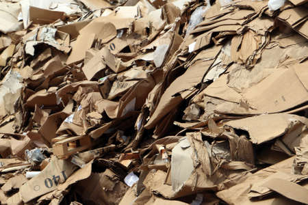 Cluttered cardboard in landfillの写真素材