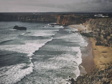 Nature of south Portugal ocean and rocks in fog. Atmospheric Photoの写真素材