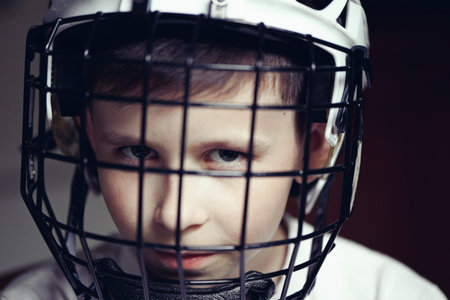Little boy in the hockey helm. Emotions of child. Sport conceptの写真素材