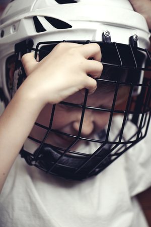 Little boy in the hockey helm. Emotions of child. Sport conceptの写真素材