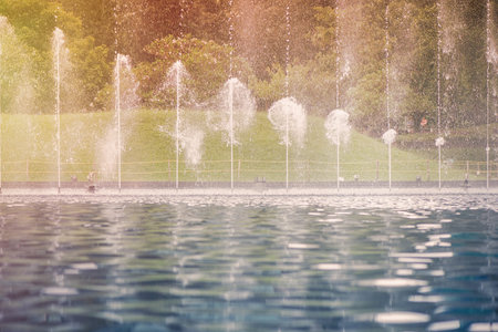Fountain in KLCC Park in Kuala Lumpur on sunset. Malaysiaの写真素材