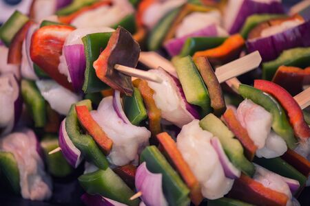 Asian shish kebab from vegetables and seafood on wooden skewersの写真素材