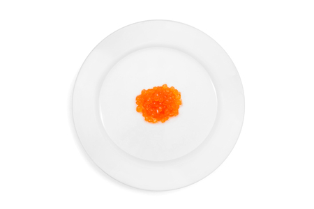 Top view of plate with red salmon caviar on the white background. Concept of gourmet food. Isolatedの写真素材