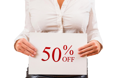 Female in the blouse holding white paper with inscription 50% OFF. Special Offer. Sales and discount concept. White background.の写真素材