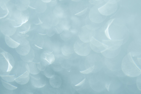 Pattern of ice frost on the glass of window with bokeh. Winter background ant texture. Close upの写真素材