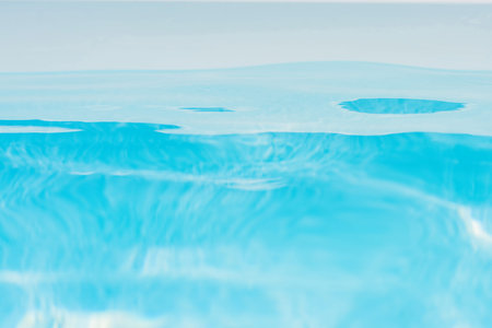 Transparent underwater texture and background of pool water