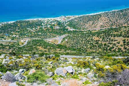 Top view from the mountains to the village of Malia, roads and the nearby villages of the field and the Aegean Sea. Crete, Greeceの写真素材