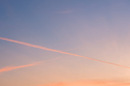 sunset background. sky with soft and blur pastel colored clouds. sunshine through the gradient cloud...