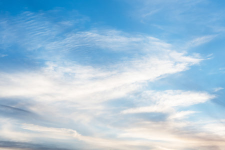sunset background. sky with soft and blur pastel colored clouds. sunshine through the gradient cloud...