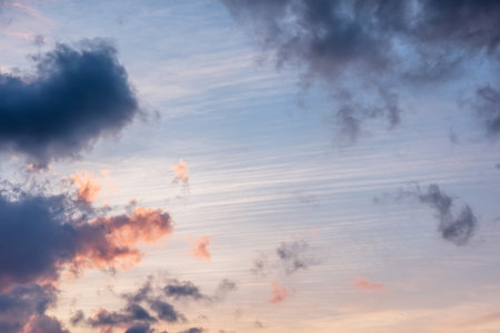 sunset background. sky with soft and blur pastel colored clouds. sunshine through the gradient cloud...