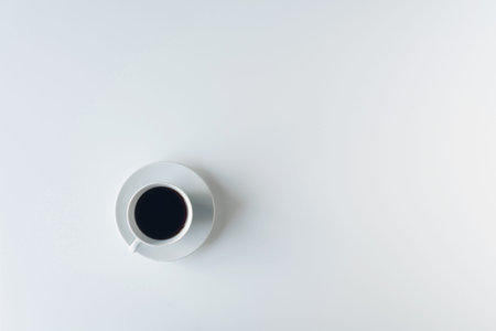 cup with black coffee on the white table. flat lay, top view. coffee artの写真素材