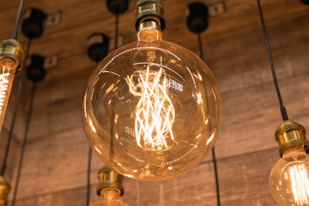 Burning of sets huge incandescent edison lamps with a large decorative spiral