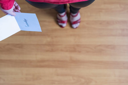 woman with paper letter and word goodbye on a floor. Heart broken concept. Copy Space