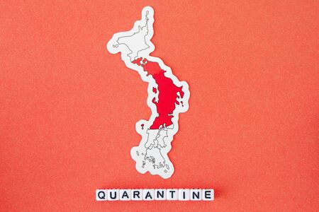 Map of Japan and word quarantine on a red background. Worldwide pandemic conceptの写真素材