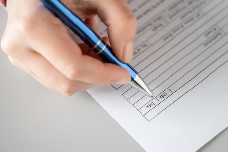 Woman filling hotel reservation form putting check mark on Mrs. Reception desk. Hotel service,...