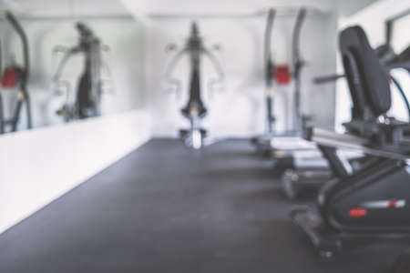 Unfocused and blurred fitness gym sport equipment, simulators. Background.の写真素材