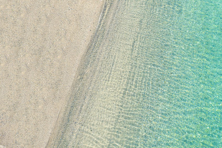 Blue, turquoise transparent water surface of ocean, sea, lagoon. Horizontal background. Top view of...