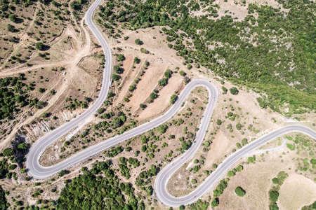 Meandering serpentine road in the mountain. aerial view. Copter, drone viewの写真素材