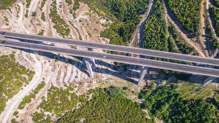 Aerial view on highway bridge in the mountain. Drone, copter view.