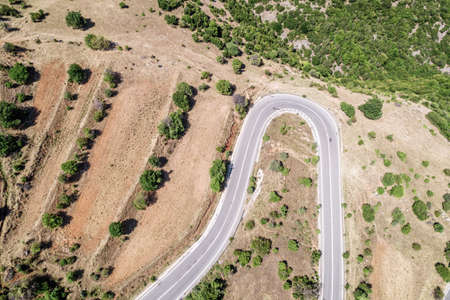 Meandering serpentine road in the mountain. aerial view. Copter, drone viewの写真素材