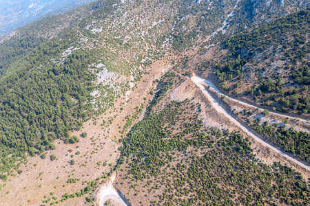 Meandering serpentine road in the mountain. aerial view. Copter, drone viewの写真素材
