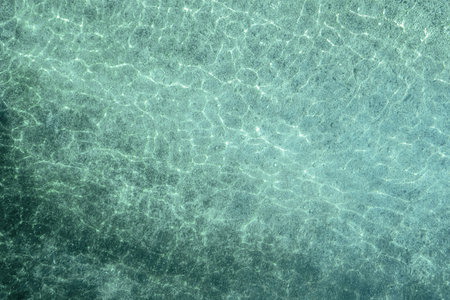 Blue, turquoise transparent water surface of ocean, sea, lagoon. horizontal background. Top view of...