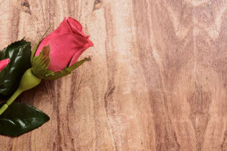 Valentine wooden background with hearts and flowersの写真素材