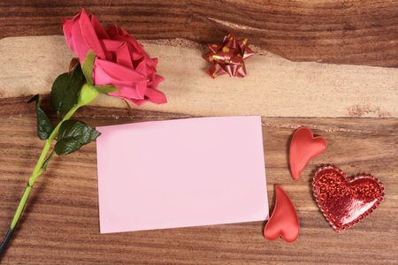 Valentine wooden background with hearts and flowersの写真素材