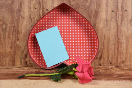 Valentine wooden background with hearts and flowersの写真素材