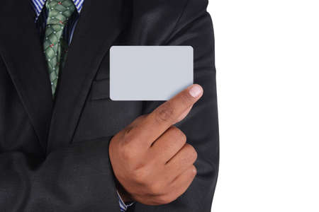 Businessman holding card in black suit isolated on white backgroundの写真素材