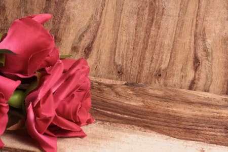 Valentine wooden background with hearts and flowersの写真素材