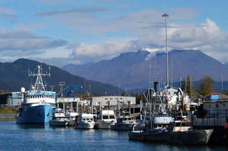 Fishing harbour in Whittier, Alaska with mountains and glacier in backgroundのeditorial素材