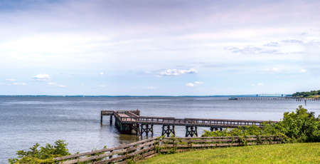 Chesapeake Bay Maryland Panorama with Bay Bridge, boathouse, lighthouse and fishing pierの写真素材