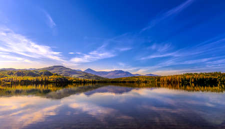 A beautiful sunset on Skilak lake on the Kenai peninsula in Alaska during Autumnの写真素材