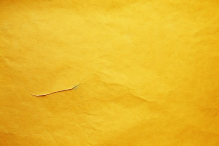 Old paper texture for background. Yellow paper sheet with torn edges.の素材