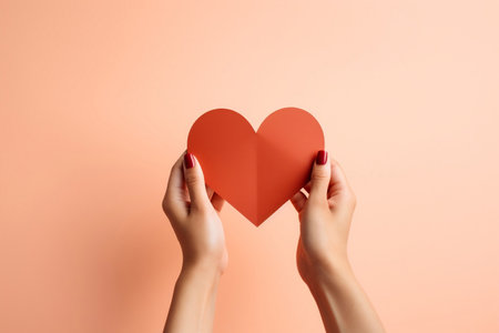 Realistic DSLR Photography of a Hand Holding an Isolated Heart-Shaped Paper Cutoutの素材